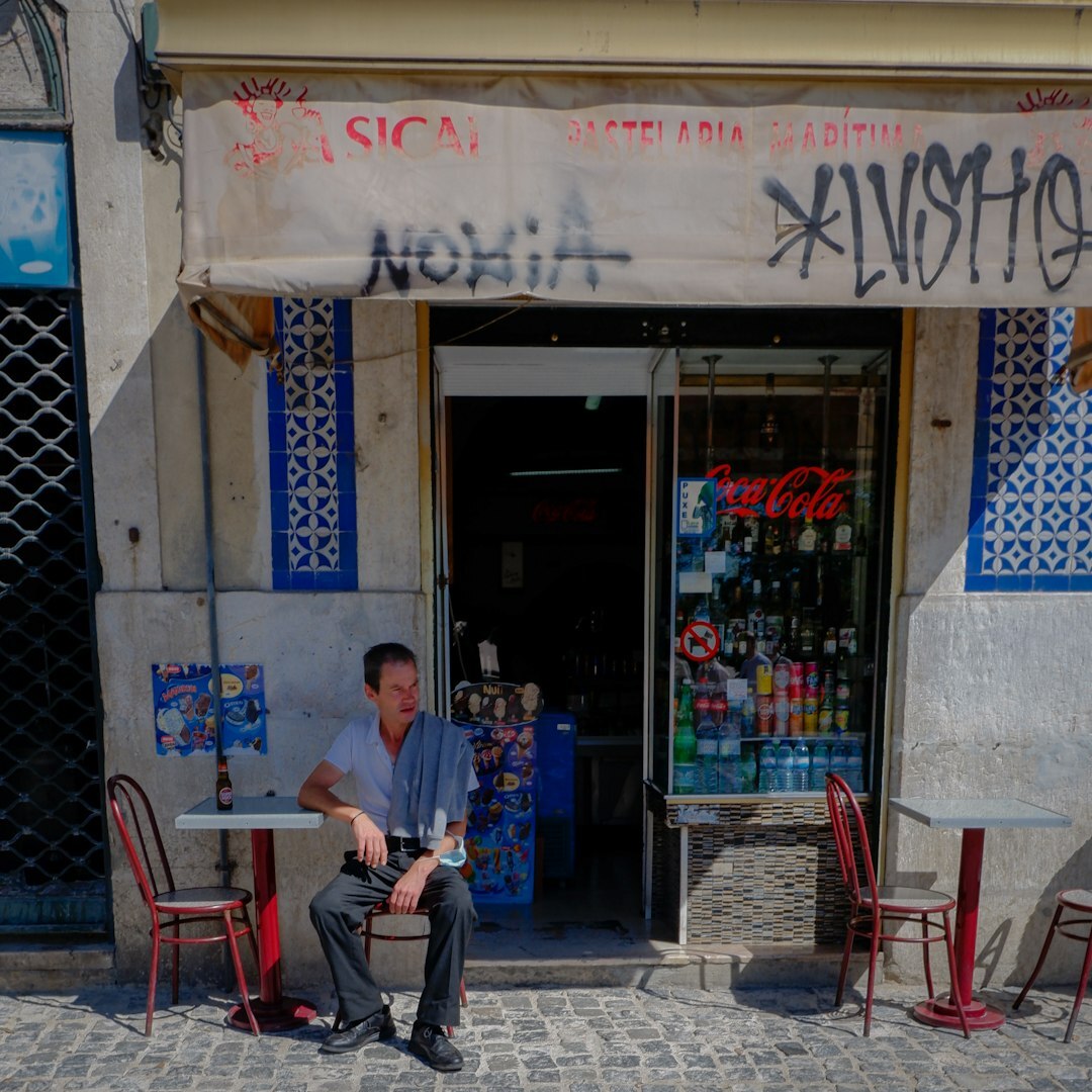 Turkish man in his thirties explaining camera settings to a small group
